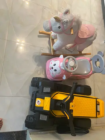 Bundle of kids ride-on toys: rocking unicorn, push car, and battery quad