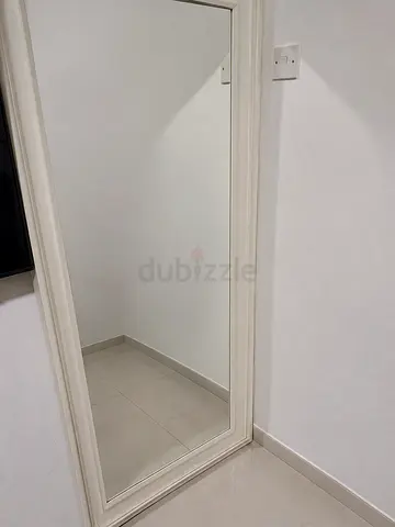 Full-length freestanding mirror with white frame