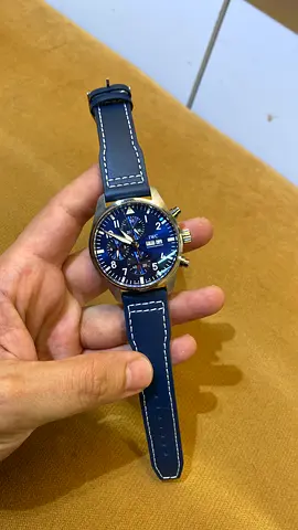IWC Pilot’s Watch Chronograph with a blue dial and a blue leather strap (such as the 41mm Super mast