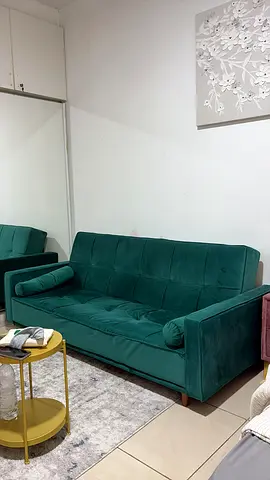 Green velvet 3-seater sofa in excellent condition