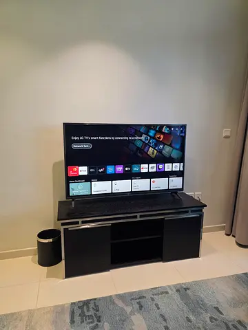 Black Wood TV Unit with Chrome - AED 400