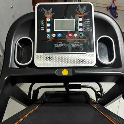 Used treadmill with console and cup holders - good working condition