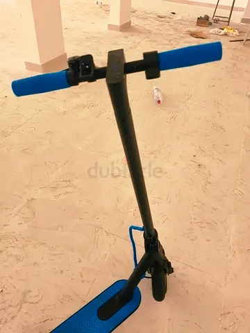 Electric scooter with blue grips and deck - good working condition