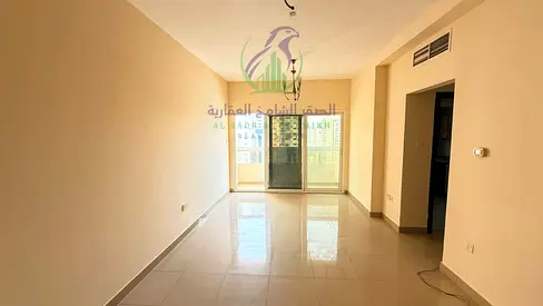 Spacious apartment with a living room, modern finishes, a balcony with a view, and free parking. Located in a prime area of Al Taawun