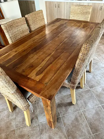 A solid wood sturdy 6 seater dining table .