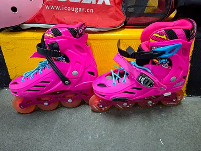 Pink adjustable inline roller skates - kids size, good condition