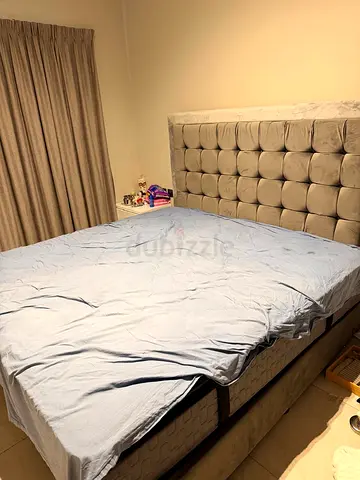 King Koil branded King size upholstered bed with storage and padded headboard