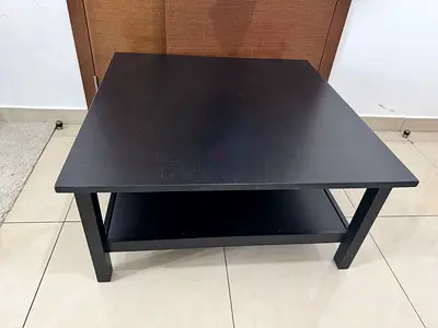 Solid black square coffee table with lower shelf - good condition