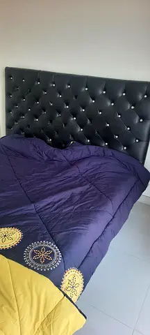 Queen bed with tufted faux leather headboard and mattress - Good condition