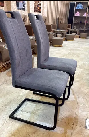 Pair of Modern Grey Upholstered Dining Chairs with Cantilever Base