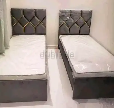 Pair of single beds with storage and upholstered headboards - grey