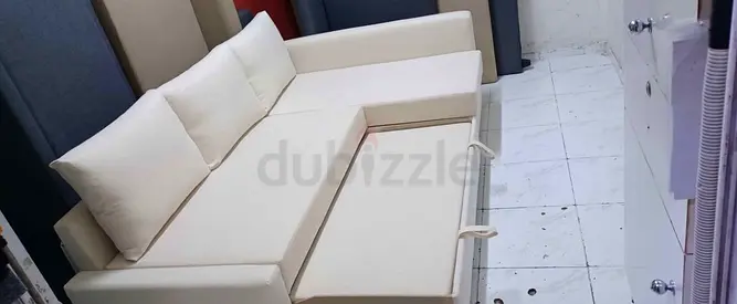 Cream L-shaped Sofa Bed with Storage — Good Condition