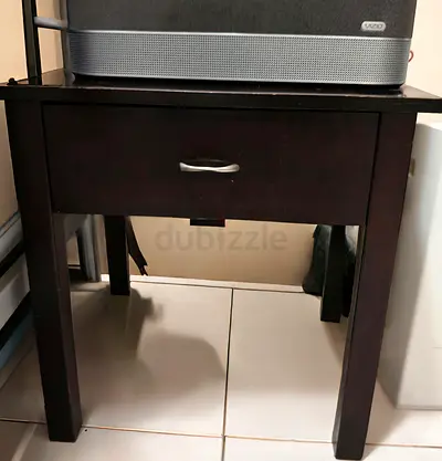 Dark wood bedside table with single drawer - good used condition