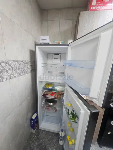 Used double-door refrigerator in good working condition