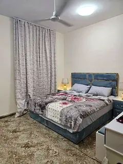 For monthly rent: a high-end furnished one-bedroom and living room unit in Al Butina, Sharjah.