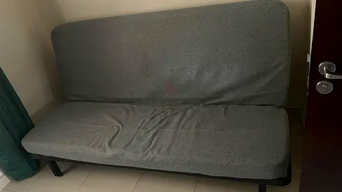 Used grey fabric sofa bed / futon - compact, good for small spaces