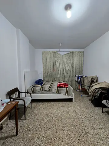 Executive and family room with furniture and attached both room