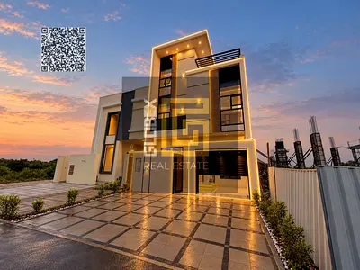 Modern-design townhouse for sale featuring 5 master bedrooms; prime location in Al Helio 2, opposite Al Safeer.