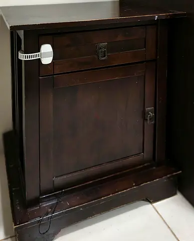 Dark wood bedside cabinet with single drawer and cupboard — good used condition