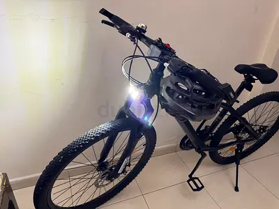 Used Black Mountain Bike with Helmet and Front Light - Good Condition