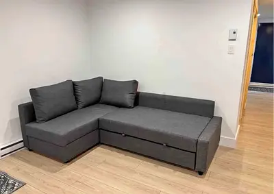 Grey L-shaped Sofa bed with Storage and Chaise - Good Condition