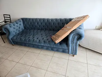 Blue tufted 4-seater Chesterfield-style sofa — good condition