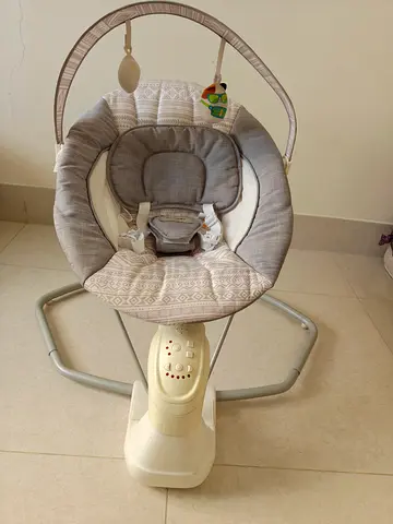 Baby electric swing/rocker with toy bar - neutral grey, good condition