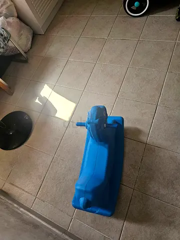 Blue plastic ride-on dolphin scooter for toddlers - good condition