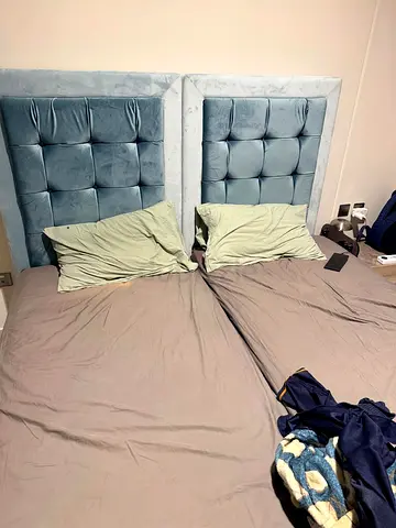 Pair of light blue upholstered tufted headboards - good condition