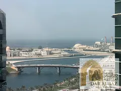 A three-bedroom apartment with a living room is available for annual rent in the Al Majaz 1 area of