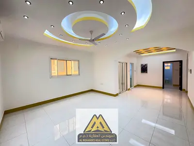 2-bedroom apartment with a spacious living room for rent in Al Jurf 2, Ajman, behind Safeer Mall. New building, kitchen, laundry room, split AC, annua