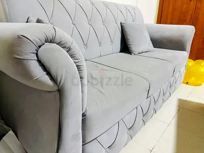 Light grey 3-seater sofa with cushions and 4 pillows