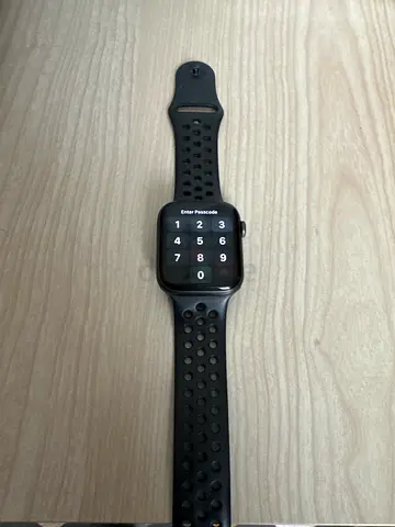 Apple Watch (Series 5 - Nike Edition) with black sport perforated band - good condition