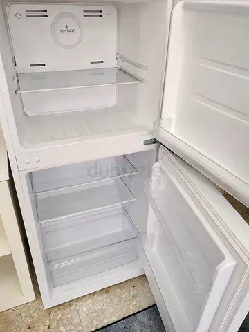 1- Compact white double door fridge 2- Microwave both clean interior, good working condition.
