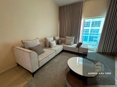 A fully furnished one-bedroom apartment featuring high-end furniture and luxury appointments. It is