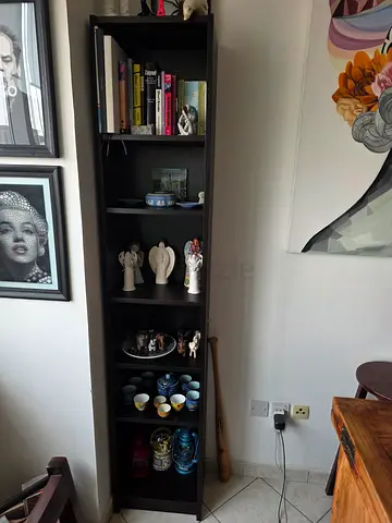 Tall dark IKEA Billy bookcase with multiple shelves - good condition