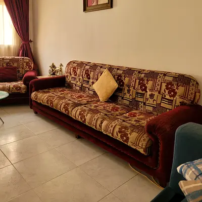 Genuine Wood. Four-seater and 4 single seats. Vintage patterned fabric sofa in good condition