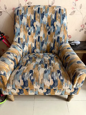 Single upholstered armchair in blue-beige abstract fabric, good condition