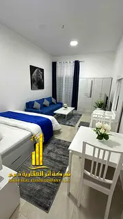 Furnished luxury studio with a separate kitchen and balcony offering an open view in Ajman (Al Muwai