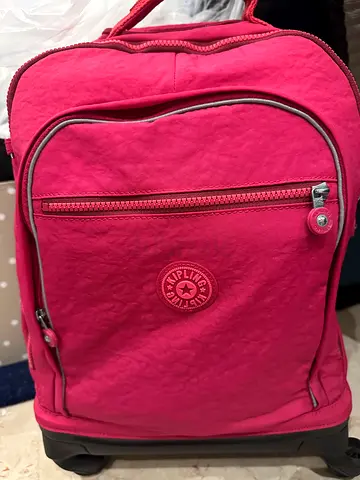KIPLING Pink wheeled backpack with front pocket and tow handle