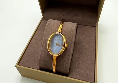 Gold-tone Oval Bangle Watch with Mother of Pearl Dial (Women's)