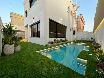 Modern-finish villa in Al Rawda 1, Ajman, featuring a swimming pool and located directly in front of the mosque; includes electricity and water; freeh