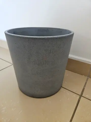 Simple grey cylindrical indoor/ outdoor stone plant pot