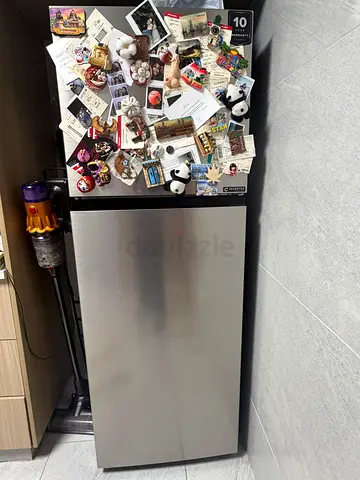 Compact stainless steel fridge in good working condition