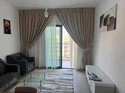 For monthly rent: a furnished one-bedroom apartment (bedroom and living room) with hotel-style furnishings, located in Maryam Island, Al Khan, Sharjah
