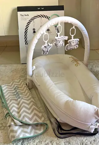 Portable baby lounger with toy arch and carry bag - like new