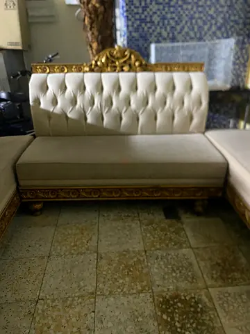 Classic cream tufted 3-seater sofa with carved gold trim