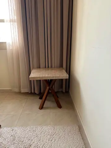Small wooden side table with stone-look top