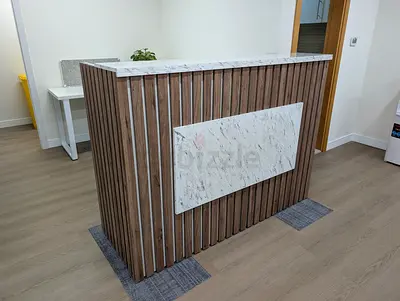 Wood Slat Reception Desk with Marble Top and Front Panel