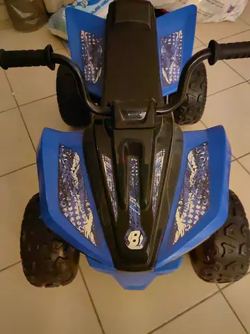 Blue electric ride-on quad for kids — good condition